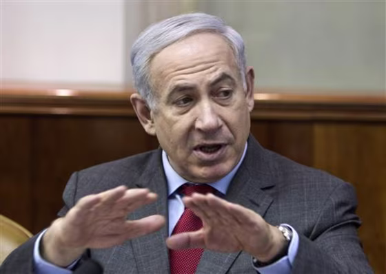Israeli Prime Minister Benjamin Netanyahu convenes the weekly cabinet meeting in Jerusalem, Sunday, Feb. 26. Netanyahu says Iran's nuclear program will take center stage in his upcoming talks with North American leaders.